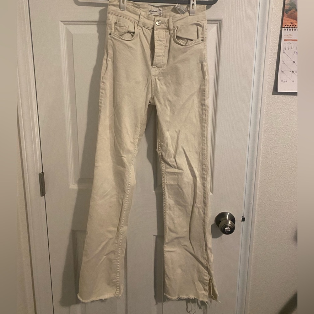 Cream/tan jeans with flared legs